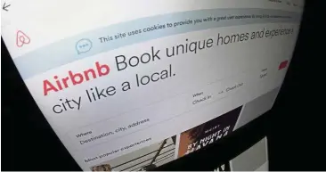  ?? —AFP ?? Stricter controls: The logo of online lodging service Airbnb displayed on a computer screen in Paris. The New York City Council has required Airbnb to disclose to the city detailed informatio­n about its hosts, which could wipe out a share of listings by cracking down on illegal rentals and spooking other hosts from listing.