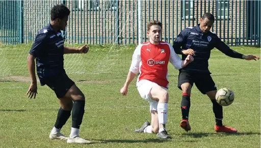  ??  ?? ● Lancashire and Cheshire League action from Urmston Town (in dark blue) against Mellor