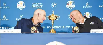  ?? — AFP photo ?? In this file photo taken on October 17, 2017 shows USA’s Ryder Cup captain, Jim Furyk (L) and Europe’s Ryder Cup captain Thomas Bjorn giving a press conference in Paris.