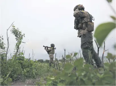  ?? Picture: AFP ?? TRIGGERED. Members of Ukraine’s 28th Separate Mechanised Brigade fire a grenade launcher near the town of Bakhmut, Donetsk region, on Saturday.