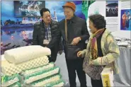  ??  ?? Bedding products made in Laos are popular among senior citizens visiting the expo.