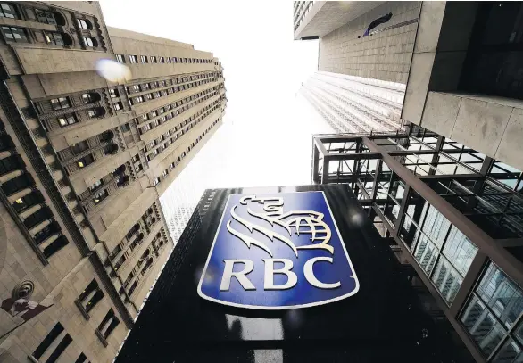  ?? NATHAN DENETTE/THE CANADIAN PRESS FILES ?? RBC reported solid results across most business segments this earnings season and plans to hike its quarterly dividend by three cents to 94 cents a share, despite the U.S. tax reform weighing on its first-quarter earnings. RBC returned 74 per cent of...