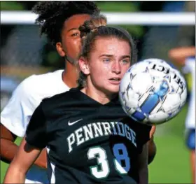  ?? BOB RAINES — DIGITAL FIRST MEDIA ?? Pennridge’s Meghan Criney traps the ball with her chest in front of North Penn’s Olivia Urban.