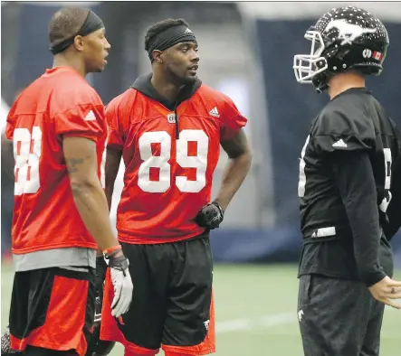  ?? MICHAEL PEAKE ?? Receivers Bakari Grant, left, and DaVaris Daniels, centre, provide two big targets for Stampeders quarterbac­k Bo Levi Mitchell in Sunday’s Grey Cup in Toronto. Daniels has been a breakout player for Calgary this year despite not playing until Week 9.