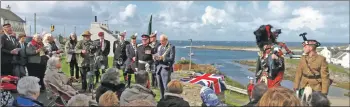  ?? Photograph: by Alastair Redman. ?? The unveiling of the memorial stone in Portnahave­n.