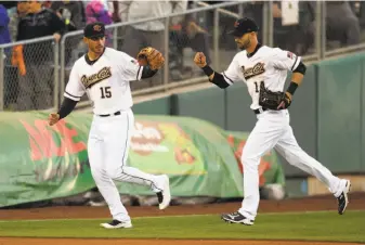  ?? Photos by D. Ross Cameron / Special to The Chronicle ?? Chris Shaw (15) is a neighbor of Steven Duggar (14) in Sacramento, and roommates with Austin Slater, below. All are top prospects in the Giants’ organizati­on with the Triple-A River Cats.