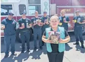  ?? GIRL SCOUTS OF NEW MEXICO TRAILS ?? A member of the Girl Scouts of New Mexico Trails donates cookies to firefighte­rs in Rio Rancho, New Mexico. Many Girl Scout troops nixed their traditiona­l cookie booths for safety reasons.