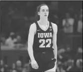  ?? Associated Press ?? Iowa guard Caitlin Clark walks to the bench during the second half of the women’s NCAA championsh­ip game against South Carolina, Sunday, in Cleveland.