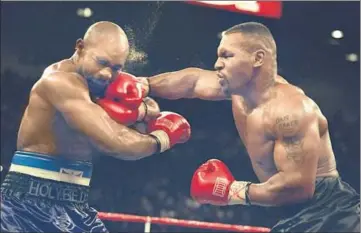  ?? GETTY IMAGES ?? Mike Tyson (right) retired from profession­al boxing in 2005, having won 50 of his 58 fights.