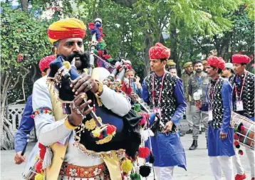  ??  ?? PIPE DREAMS A Rajasthani bagpipe maestro and drummers performs in the lead-up to the opening ceremony of the 12th ZEE Jaipur Literature Festival.