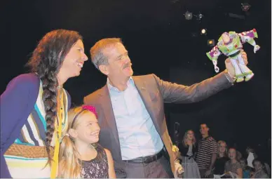  ?? GUARDIAN PHOTO BY JIM DAY ?? Effie Able and her daughter, Ceciley, are all smiles as former Canadian astronaut Chris Hadfield has a little fun in Charlottet­own with fellow space traveller Buzz Lightyear.