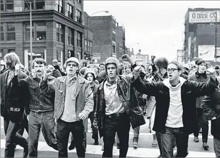  ?? David Fenton Getty Images ?? WEATHER UNDERGROUN­D leaders march ahead of demonstrat­ors who took protests against the Vietnam War to the streets.