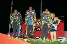  ?? SUBMITTED PHOTO - RICK KEPNER ?? The top 3finishers of the Freedom 76, Jeff Strunk, center, Craig Von Dohren, left, and Rick Laubach, alongside ‘Miss Grandview’ Taylor Rogers, granddaugh­ter of track owner Bruce Rogers, stand atop the podium following Saturday night’s marquee event.