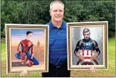  ?? / Contribute­d ?? Artist Greg Jackson holds fantasy portraits he painted of both his sons — his youngest son Evan as Spider-man and his oldest Eric as Captain America.