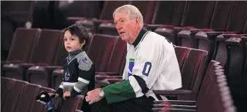  ?? WARD PERRIN/ ?? Jim Robson, shown here with grandson Theo Robson, was the radio broadcast voice of the Vancouver Canucks for almost 30 years, retiring in 1999.