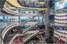  ??  ?? The MSC Seaside’s glass-walled atrium stretches over multiple decks, creating a venue for live entertainm­ent with stunning ocean views.