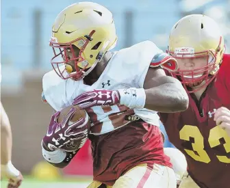  ?? STAFF PHOTO BY CHRIS CHRISTO ?? ON THE RUN: Tailback Jon Hilliman is aiming for a big game in BC’s opener.