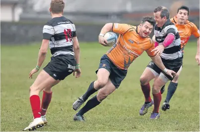  ?? Picture: Kris Miller. ?? Andrew Hamilton weaves through the defence in Dundee High’s clash with Kelso.