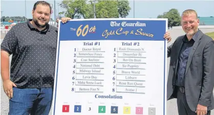  ?? JIM DAY/THE GUARDIAN ?? Rene Allard, trainer of last year’s winner Somewhere Fancy, and race manager Adam Walsh pose with the 2019 The Guardian Gold Cup and Saucer trial positions.