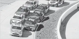  ?? MATT BELL THE ASSOCIATED PRESS ?? Ryan Blaney (12) leads during a pack of cars around the track at Martinsvil­le Speedway.