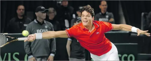  ?? STEVE BOSCH/ PNG ?? Milos Raonic of Canada lunges to attempt a return on his forehand against Julien Benneteau of France in Davis Cup singles competitio­n Friday at UBC Sports Centre in Vancouver. Raonic defeated Benneteau 6- 2, 6- 4, 7- 5 in two hours and 17 minutes. The...