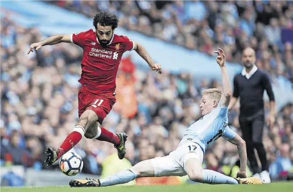  ?? Getty Images ?? Schlüssels­pieler in der Woche der Wahrheit: Liverpools Mo Salah (l.) und Manchester Citys Kevin De Bruyne.