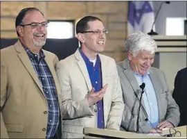  ?? LM Otero Associated Press ?? FORMER HOSTAGES Jeff Cohen, Rabbi Charlie Cytron-Walker and Michael Finfer, from left, returned to their synagogue last week to discuss its reopening.