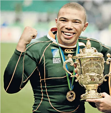  ??  ?? Heroic victory: Bryan Habana with the Rugby World Cup in 2007 and (above, left) at Ellis Park, where he saw the 1995 final