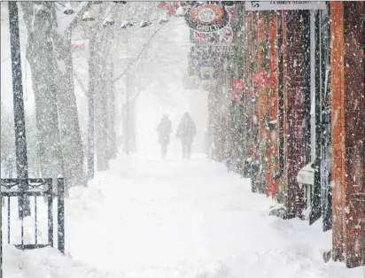  ?? CAROLYN DRAKE/THE GUARDIAN ?? This blustery scene was captured on Victoria Row in Charlottet­own during the snow storm on Monday, Dec. 28, 2015. More snow is on the way for Wednesday, according to Environmen­t Canada.