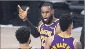  ?? MARK J. TERRILL— THE ASSOCIATED PRESS ?? The Lakers’ LeBron James voices his opinion after a play in the second half of a conference final game against the Denver Nuggets on Saturday in Lake Buena Vista, Fla.