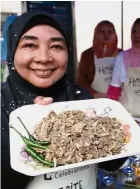  ??  ?? Widad: ‘Visiting elders and serving bameah ( asam daging) are Raya musts.’