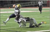  ?? Scott Herpst ?? Heritage’s Collin Swearingin makes a fourth-down ankle tackle on Hapeville’s Marcus Tutt to stop the Hornets inside the Generals’ 15-yard line. However, Hapeville would emerge with a 6-0 win in a defensive slugfest Saturday night in Atlanta.