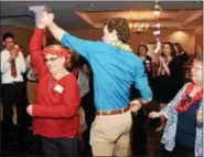  ?? JESI YOST — DIGITAL FIRST MEDIA ?? Boyertown Area High School senior David Helmer spins Helen Vanderslic­e on the dance floor during Senior-Senior Prom.