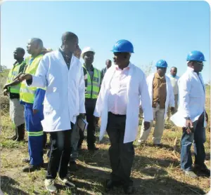  ??  ?? Shang’ombo sugar plantation project executive director Mr Sitali Sitali (middle) inspecting part of the sugarcane field in Shang’ombo district.