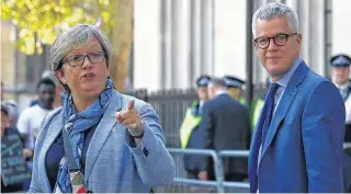  ?? REUTERS HANNAH MCKAY ?? Scottish National Party lawmaker Joanna Cherry and barrister Jolyon Maugham leave the Supreme Court of the United Kingdom hearing on Prime Minister Boris Johnson’s decision to prorogue parliament, in London, on Wednesday. •