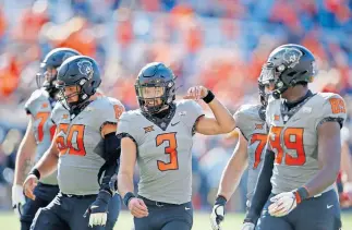  ??  ?? OSU quarterbac­k Spencer Sanders (3) completed 20 of 29 passes for 235 yards in a 24-21 victory over Iowa State. [SARAH PHIPPS/ THE OKLAHOMAN]