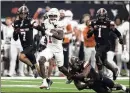  ?? TONY GUTIERREZ/AP ?? Texas wide receiver Xavier Worthy had a career high in catches for 969 yards and five touchdowns.