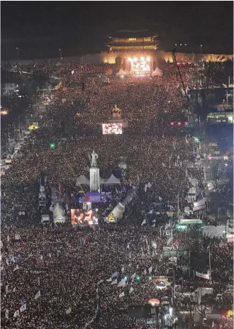  ?? Ahn Young-joon / Associated Press ?? Organizers of Saturday’s rally calling for South Korean President Park Geun-hye to step down put the crowd estimates at 1.5 million. It was the fifth-straight weekend of mass protests.