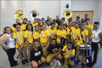  ?? ALYSSA POINTER PHOTOS / ALYSSA.POINTER@AJC.COM ?? Members of the Frederick Douglass High School marching band after practice at the school Tuesday. The band showed interest in playing during Mardi Gras in New Orleans, and they were able to get donations to help them go.