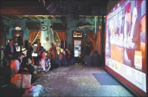  ?? David Minton / DRC ?? A crowd watches election coverage on the large screen on the stage during an election watch party at Dan's Silverleaf on Nov. 4, 2014, in Denton, Texas.