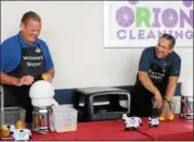  ?? KRISTI GARABRANDT — THE NEWS-HERALD ?? Willowick Mayor Rich Regovich and Eastlake Mayor Dennis Morley battle it out in a Lemon Squeeze rematch at Classic Park to benefit the Miracle League of Lake County, Aug. 18.