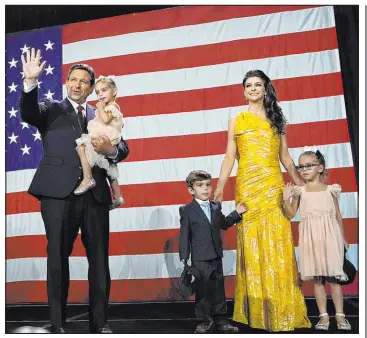  ?? Rebecca Blackwell The Associated Press ?? Florida Gov. Ron Desantis, his wife Casey and their children head offstage after speaking to supporters Tuesday at an election night party in Tampa, Fla.