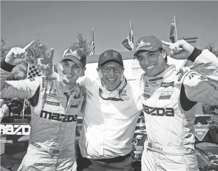  ?? COURTESY OF IMSA ?? Oliver Jarvis (from left), Mazda motorsport­s director John Doonan and Tristan Nunez celebrate their victory at Canadian Tire Motorsport­s Park.
