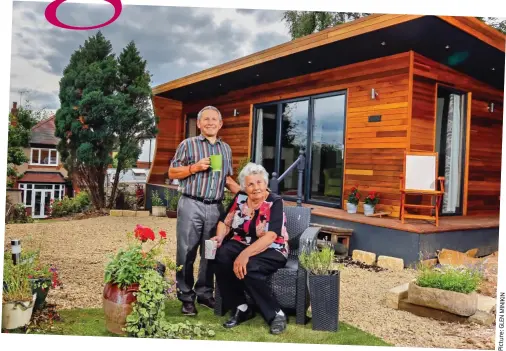  ??  ?? Home comfort: Kath Lowe with son Andy in front of her Garden Hideouts lodge in his garden