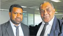  ?? Picture: RUSIATE VUNIREWA ?? Newly sworn in JPs Taniela Naika of Sabeto, right, and Apisalome Waqainavun­ivalu Metuisela of Naboro.