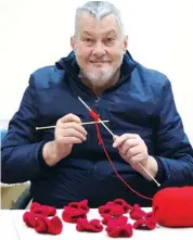  ??  ?? Phillip Boaden might have double vision but he was clocking the needles at the Vision Australia Warragul centre earlier this week knitting red poppies to give to a school to mark Remembranc­e Day on November 11.