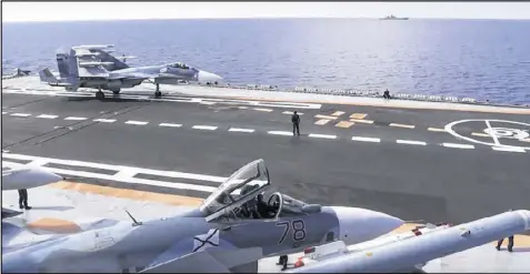  ?? CONTRIBUTE­D BY RUSSIAN DEFENSE MINISTRY PRESS SERVICE 2016 ?? Russian fighter jets sit on the deck of an aircraft carrier in the Mediterran­ean Sea in November. A U.S. commander said that Russian aircraft mistakenly bombed Syrian fighters Tuesday.
