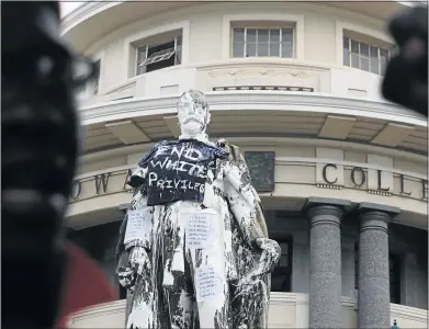  ?? PHOTO: JACKIE CLAUSEN ?? WHITEWASHE­D: Groups protesting symbols of white privilege have defaced a statue of King George V at the University of KwaZulu-Natal ’ s Howard College campus