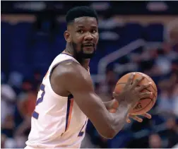  ??  ?? Suns center Deandre Ayton, shown earlier this season, returned from a 25-game suspension on Tuesday night.