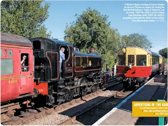  ??  ?? A Western Region meeting in Eastern Region territory at Thuxton on August 26, during the Mid-Norfolk Railway’s ‘Tanks &amp; Tankards’ real ale event. ‘15XX’ No. 1501 is on the 3.45pm from Dereham, while ‘64XX’ No. 6430 is propelling autotraile­r No. W167 on the 3.45pm from Wymondham Abbey. G.D. KING